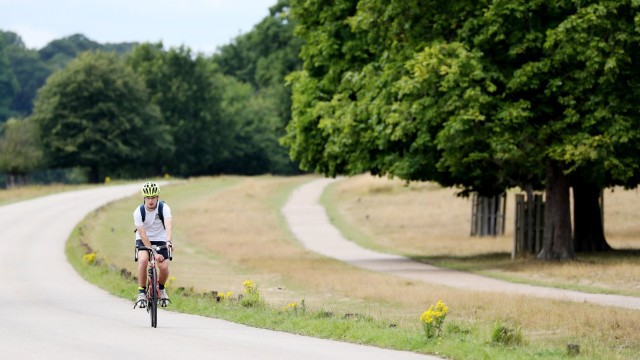 Article thumbnail: A cyclist travels through Richmond Park as the Government launches a strategy to get more people cycling. Thousands of miles of new protected bike lanes, cycle training for everyone and bikes available on prescription will be rolled out under new plans to overhaul cycling and walking in England. PA Photo. Picture date: Tuesday July 28, 2020. See PA story TRANSPORT Cycling. Photo credit should read: Jonathan Brady/PA Wire