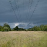 Article thumbnail: Electricity pylons along power lines under heavy grey sky in the countryside on 20th June 2020 in Studley, United Kingdom. An overhead power line is a structure used in electric power transmission and distribution to transmit electrical energy across large distances. It consists of one or more uninsulated electrical cables (commonly multiples of three for three-phase power) suspended by towers or poles. (photo by Mike Kemp/In PIctures via Getty Images)