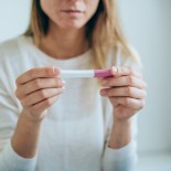 Article thumbnail: Cropped shot of disappointed young woman getting unexpected result from pregnancy test.