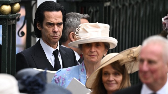 Article thumbnail: Nick Cave walks outside Westminster Abbey following Britain's King Charles' coronation ceremony, in London, Britain May 6, 2023. REUTERS/Dylan Martinez