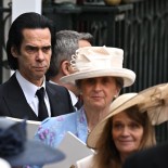 Article thumbnail: Nick Cave walks outside Westminster Abbey following Britain's King Charles' coronation ceremony, in London, Britain May 6, 2023. REUTERS/Dylan Martinez