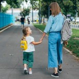 Article thumbnail: Anonymous Mother walking together with her daughter, holding her hand