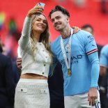 Article thumbnail: Soccer Football - FA Cup Final - Manchester City v Manchester United - Wembley Stadium, London, Britain - June 3, 2023 Manchester City's Jack Grealish with ITV presenter Laura Woods after winning the FA Cup REUTERS/Carl Recine