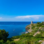 Article thumbnail: A historic tower overlooking the natural port of Capraia (Photo: Guido Cozzi/Atlantide Phototrave/Getty Images)