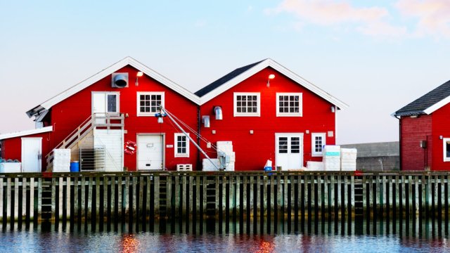 Article thumbnail: Red rorbu buildings in Bodo harbour from where visitors can cross cross Saltenfjorden to the world’s strongest maelstrom, the Saltstraumen (Photo: alxpin/Getty Images)