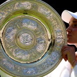 Article thumbnail: FILE PHOTO: Tennis - Wimbledon - All England Lawn Tennis and Croquet Club, London, Britain - July 9, 2022 Kazakhstan's Elena Rybakina celebrates with the trophy after winning the women's singles final against Tunisia's Ons Jabeur REUTERS/Hannah Mckay/File Photo