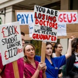Article thumbnail: LONDON, UNITED KINGDOM - 2022/07/25: Medical students hold placards expressing their opinion during the demonstration outside the Department of Health and Social Care. NHS doctors, nurses, and other allied healthcare professionals gathered outside the Department of Health and Social Care, demanding a pay rise to match the inflation rate. The crowds later marched to Downing Street and demanded the government respond to their demands or else will plan for industrial actions in the coming months. (Photo by Hesther Ng/SOPA Images/LightRocket via Getty Images)